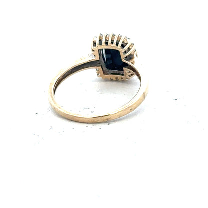 9ct yellow gold sapphire and diamond ring, size O, featuring a central sapphire gemstone and small diamond accents.