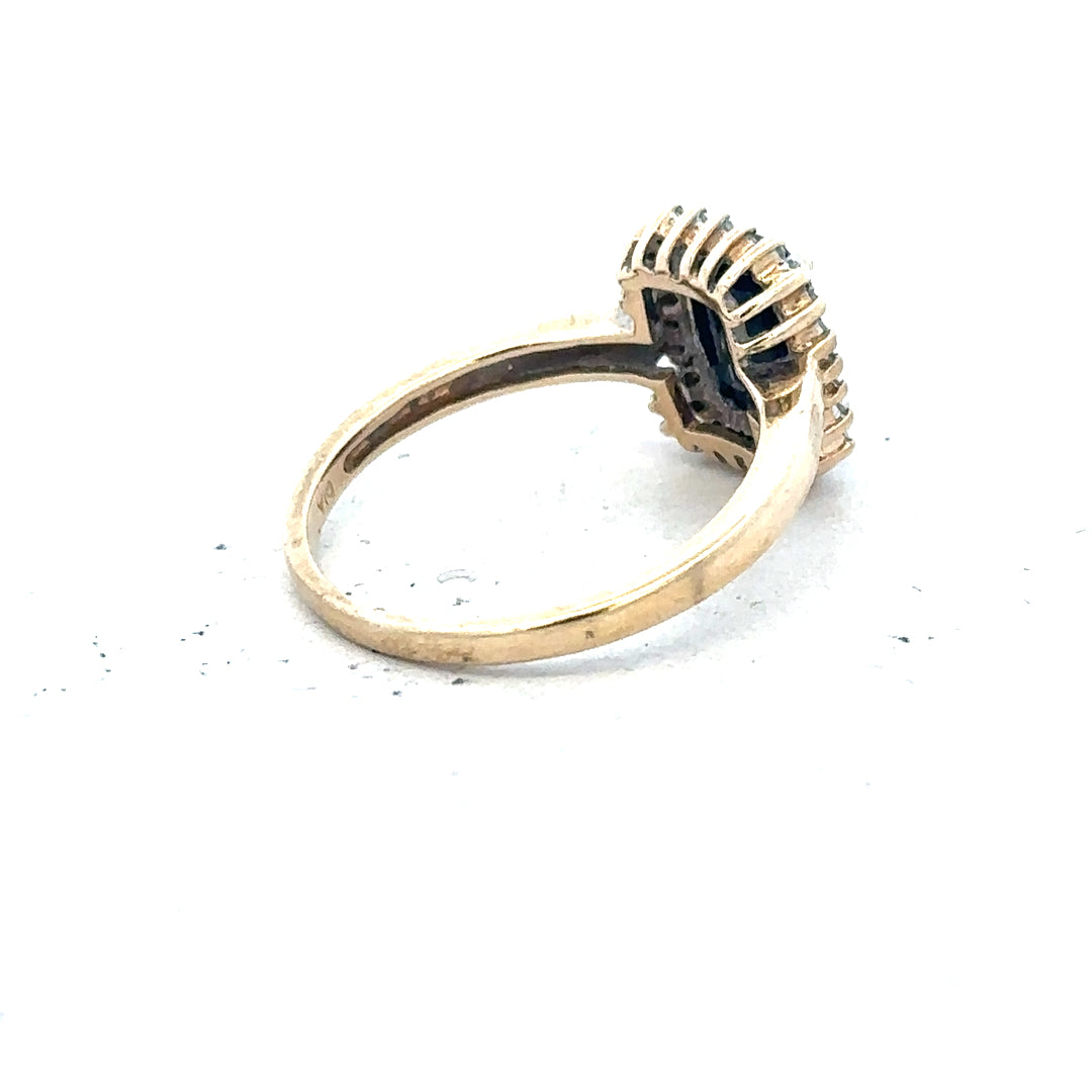 9ct yellow gold sapphire and diamond ring in size O, featuring a detailed design with sparkling gemstones.
