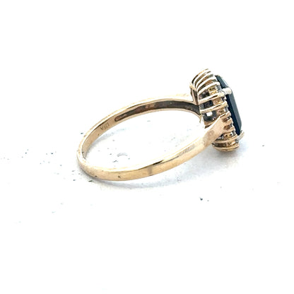 9ct yellow gold sapphire and diamond ring in size O, featuring a detailed design with sparkling gemstones.