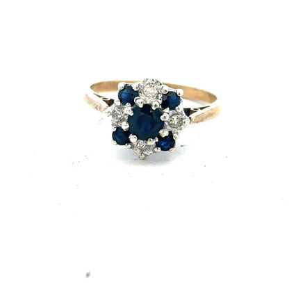 9ct yellow gold sapphire and diamond ring in size P, featuring a central sapphire with diamond accents on a sleek band.