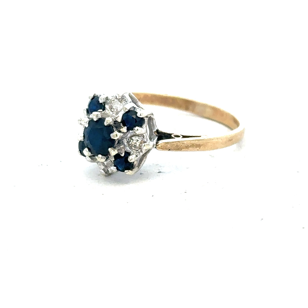 9ct yellow gold sapphire and diamond ring, size P, featuring a central sapphire stone with diamond accents.