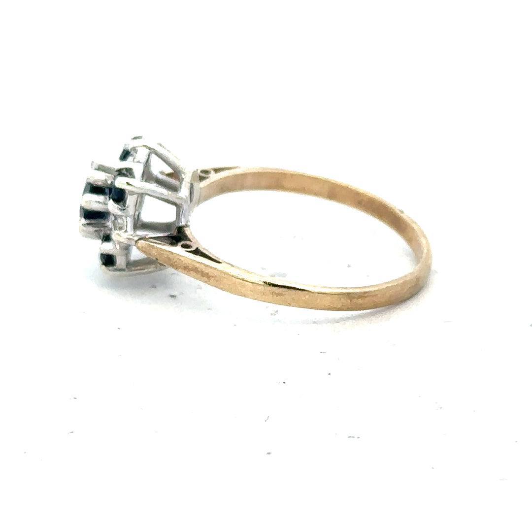 9ct yellow gold sapphire and diamond ring in size P, featuring a detailed close-up of the elegant gemstone design.
