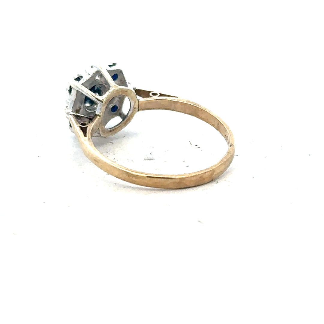 9ct yellow gold sapphire and diamond ring in size P, featuring a polished gold band with central blue sapphire and diamond accents.
