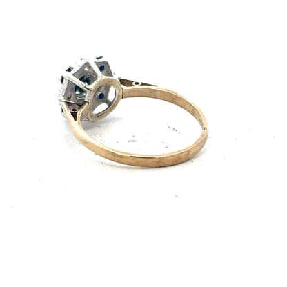 9ct yellow gold sapphire and diamond ring in size P, featuring a polished gold band with central blue sapphire and diamond accents.