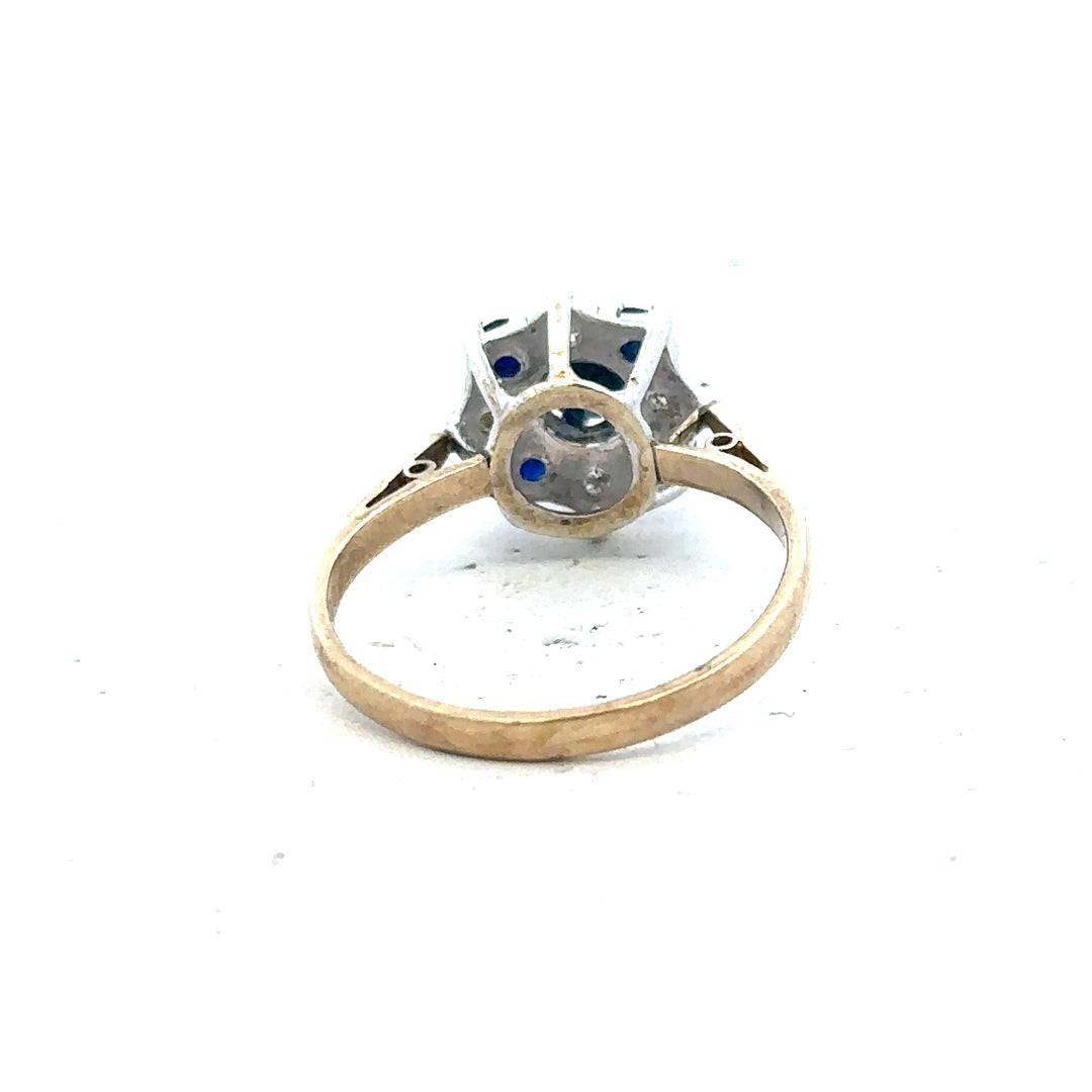 9ct yellow gold sapphire and diamond ring in size P, featuring a detailed design with sparkling gemstones.