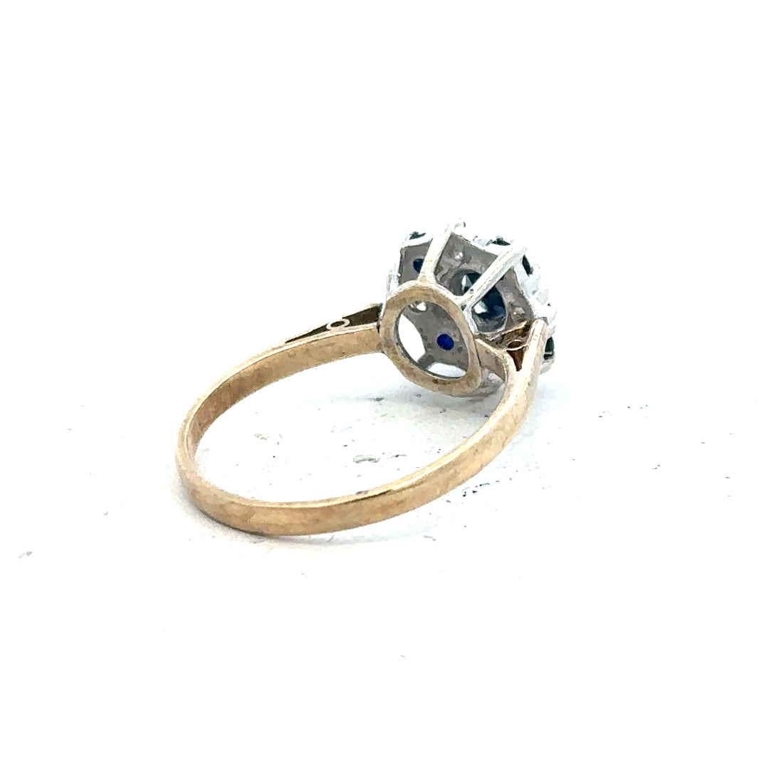 9ct yellow gold sapphire and diamond ring, size P, featuring a central sapphire surrounded by diamonds.