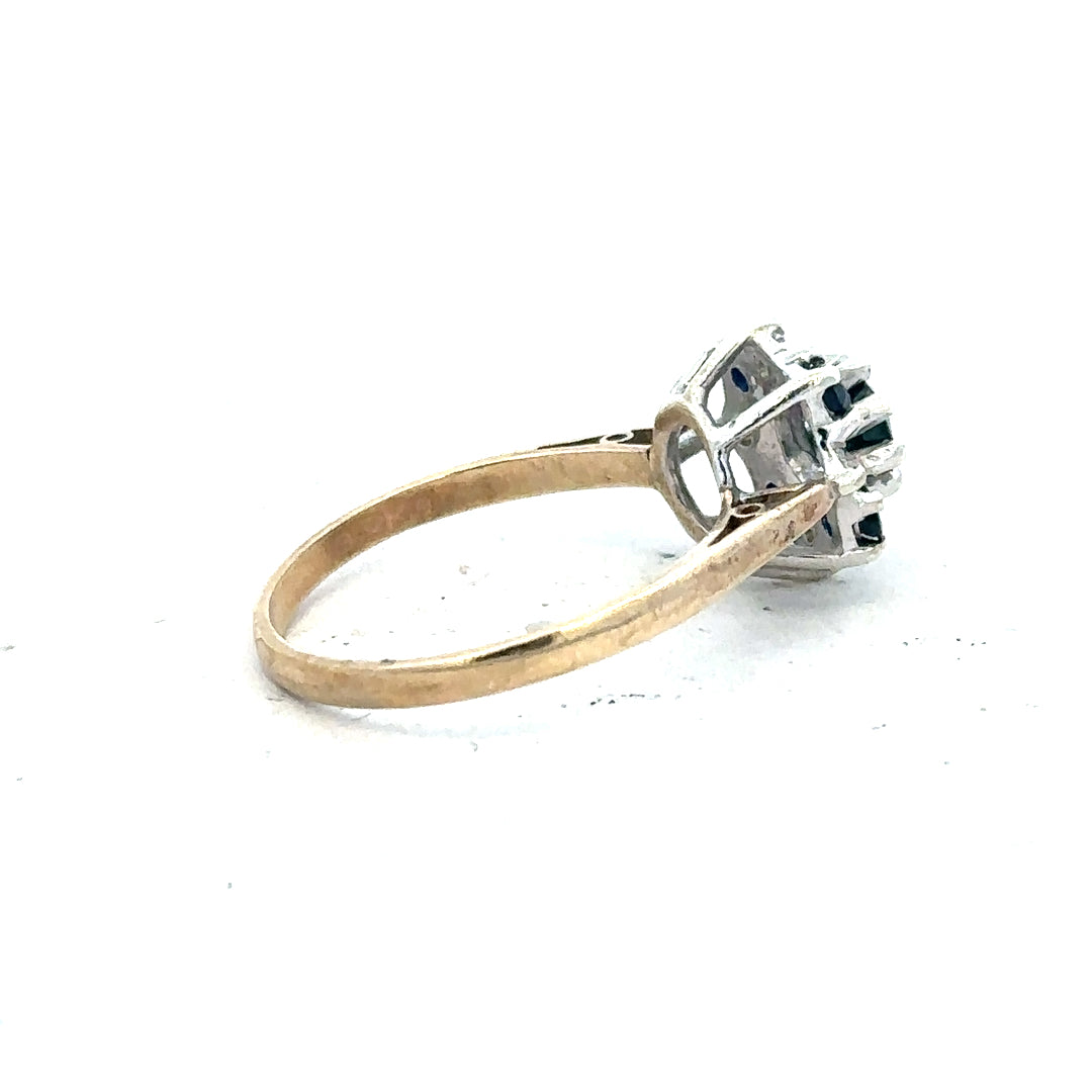 9ct yellow gold sapphire and diamond ring in size P, featuring a central sapphire gemstone with diamond accents.