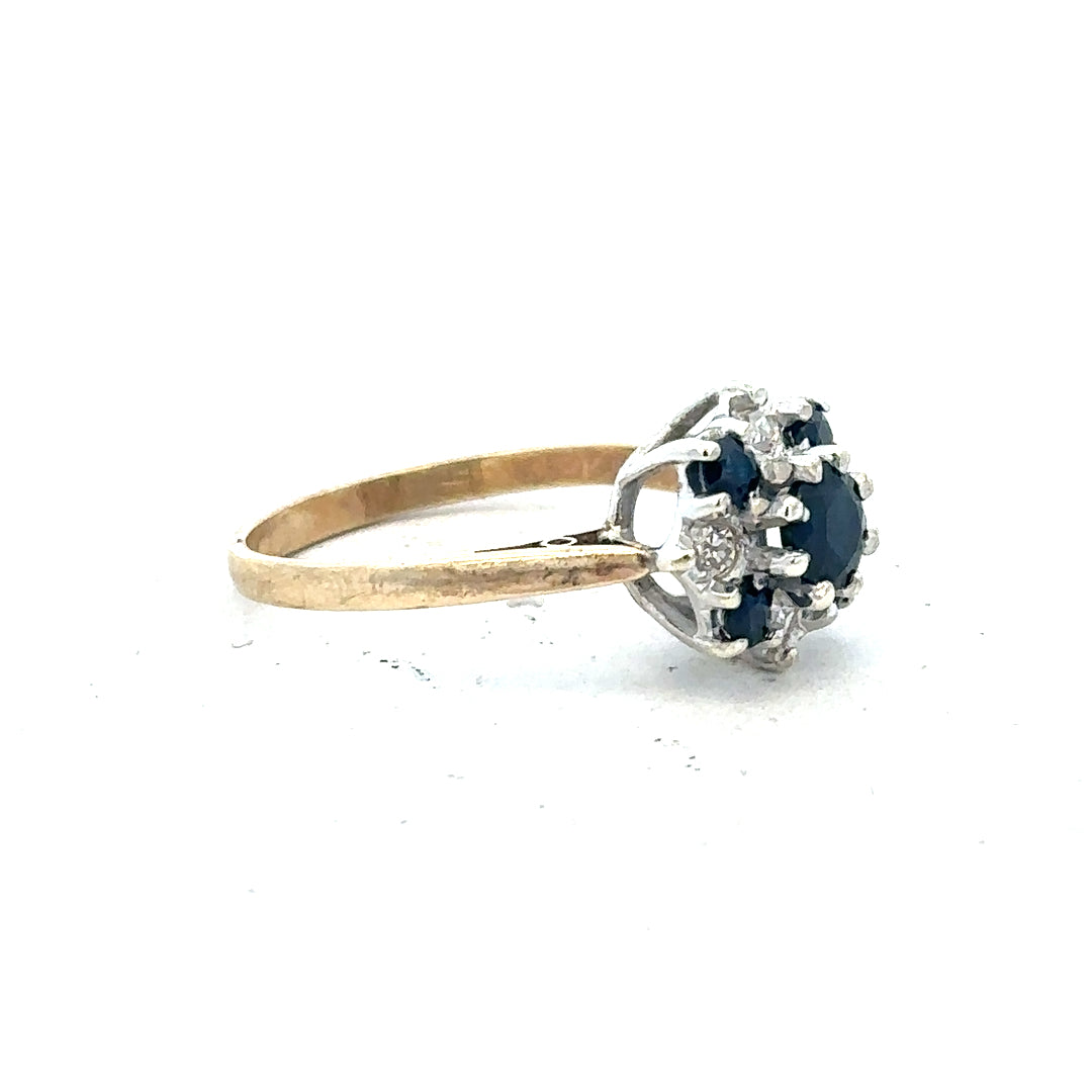 9ct yellow gold sapphire and diamond ring in size P, featuring a central sapphire with diamond accents.