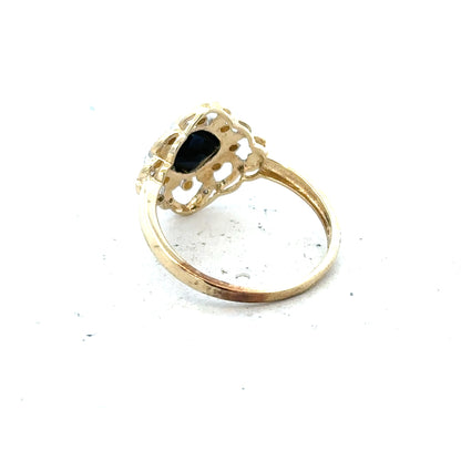 9ct yellow gold sapphire and diamond ring in size P, featuring a central sapphire with diamond accents.