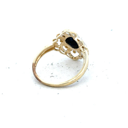 9ct yellow gold sapphire and diamond ring, size P, featuring a central sapphire gemstone with surrounding diamonds.