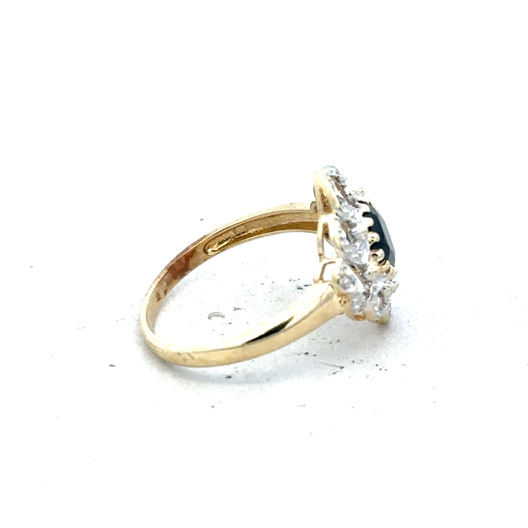 9ct yellow gold sapphire and diamond ring, size P, featuring a central sapphire gemstone with diamond accents.