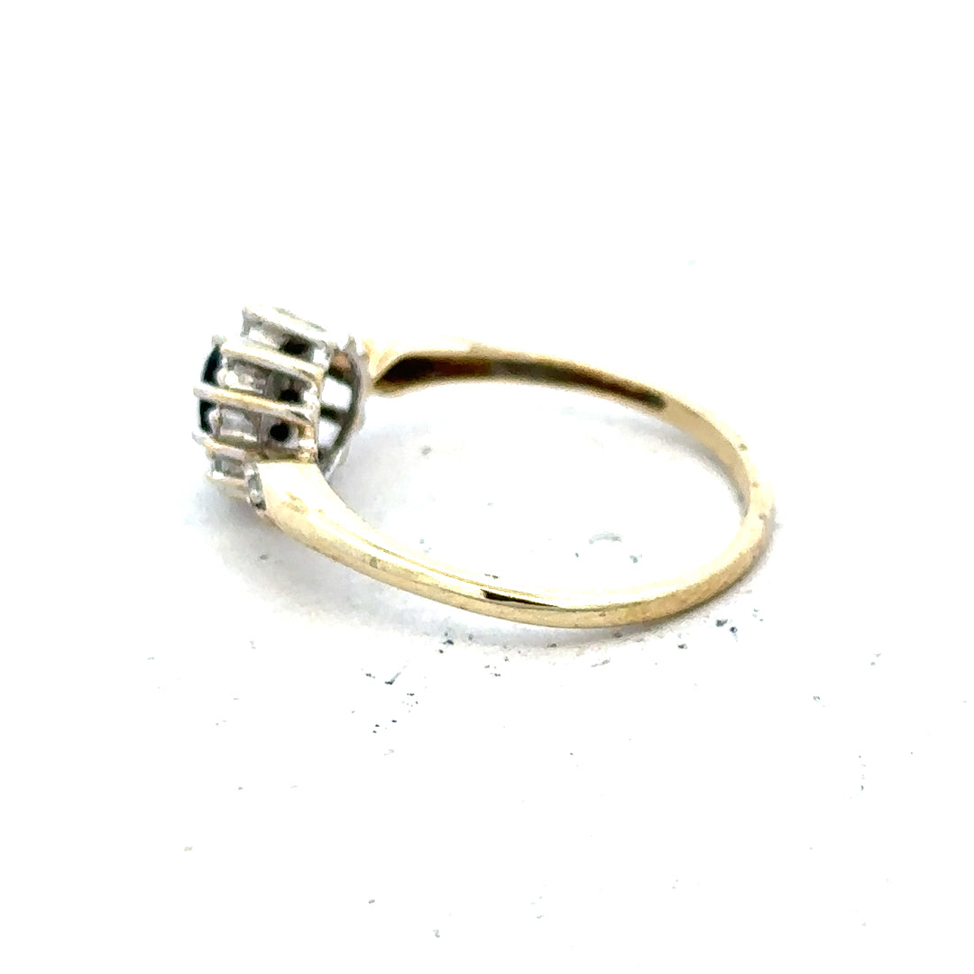9ct yellow gold sapphire and diamond ring, size P, featuring a central sapphire surrounded by diamonds, elegant jewelry piece.