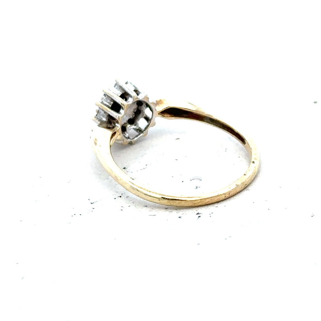 9ct yellow gold sapphire and diamond ring, size P, featuring a central sapphire gemstone with diamond accents.