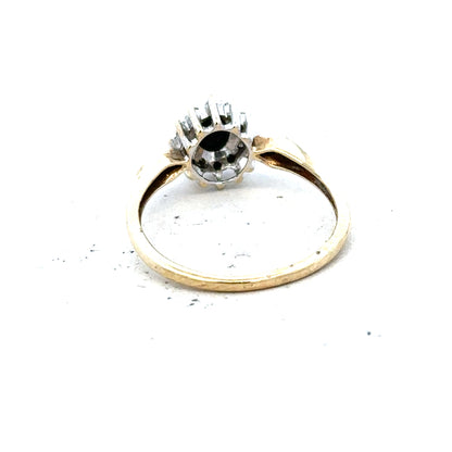 9ct yellow gold sapphire and diamond ring in size P, featuring a central sapphire with diamond accents on a elegant band.