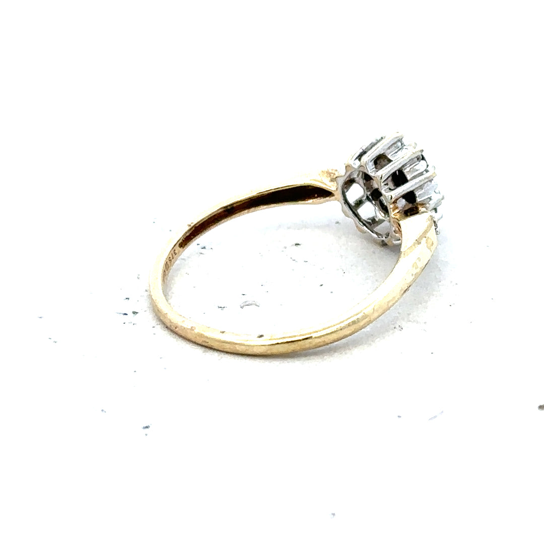 9ct yellow gold sapphire and diamond ring in size P, featuring a central sapphire gemstone and accent diamonds.