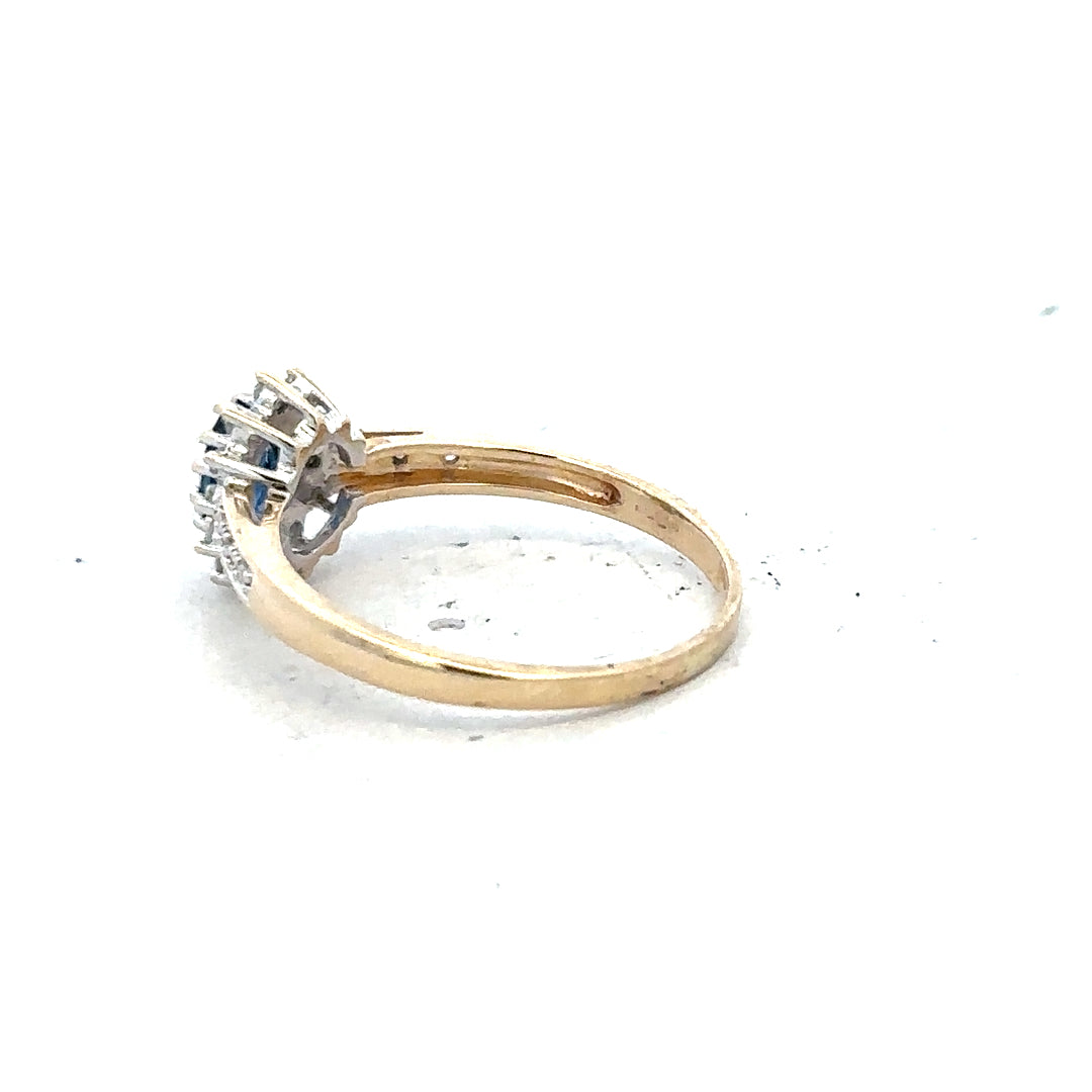 9ct yellow gold sapphire and diamond ring in size P1/2, featuring a central blue sapphire and sparkling diamonds.