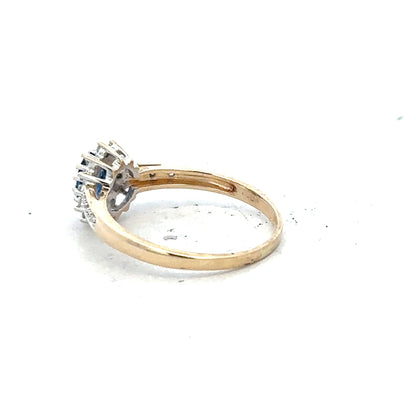 9ct yellow gold sapphire and diamond ring in size P1/2, featuring a central blue sapphire and sparkling diamonds.