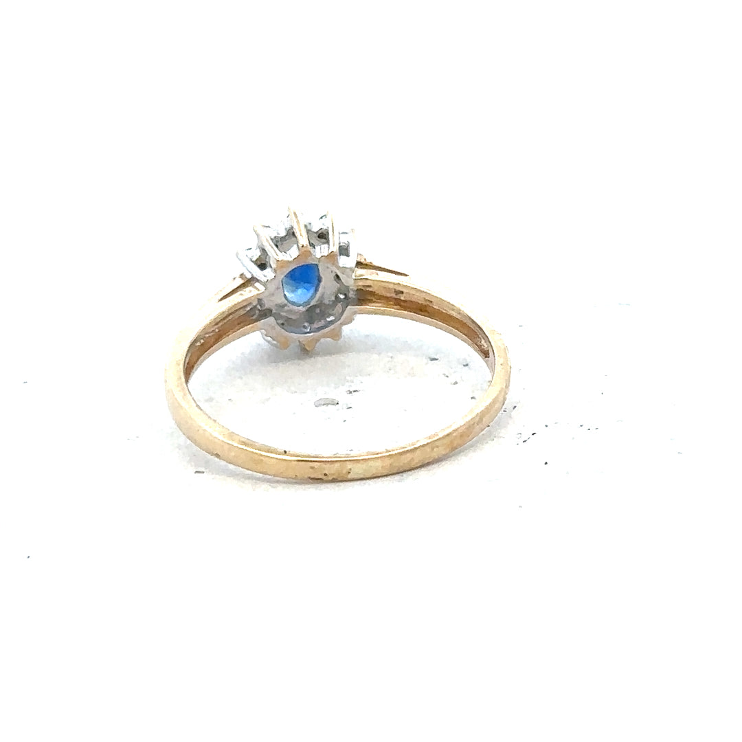 9ct yellow gold sapphire and diamond ring in size P1/2, featuring a vibrant sapphire center with sparkling diamonds.