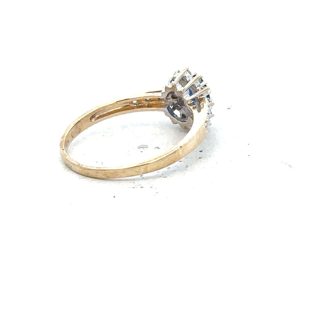 9ct yellow gold sapphire and diamond ring in size P1/2, featuring a detailed design with sparkling gemstones.