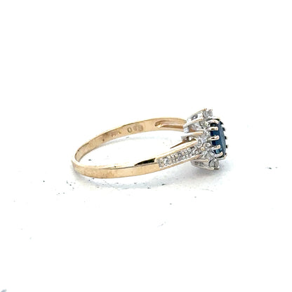 9ct yellow gold sapphire and diamond ring size P1/2 with intricate band design, showcasing vibrant blue sapphires and sparkling diamonds.