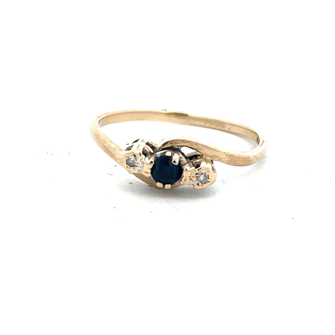 9ct yellow gold sapphire and diamond ring in size Q, featuring a central sapphire with diamond accents.