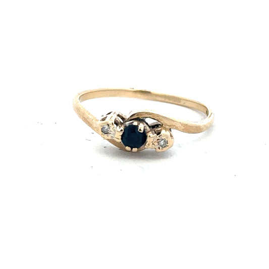 9ct yellow gold sapphire and diamond ring in size Q, featuring a central sapphire with diamond accents.
