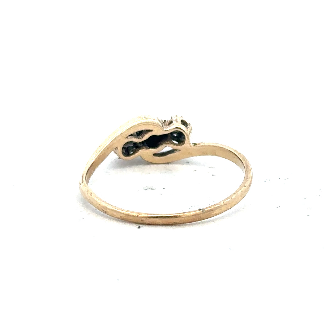 9ct yellow gold sapphire and diamond ring in size Q, featuring a central sapphire with surrounding diamonds.