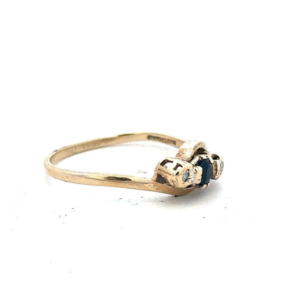 9ct yellow gold sapphire and diamond ring, size Q, featuring a central blue sapphire and sparkling diamonds, elegant jewelry piece.