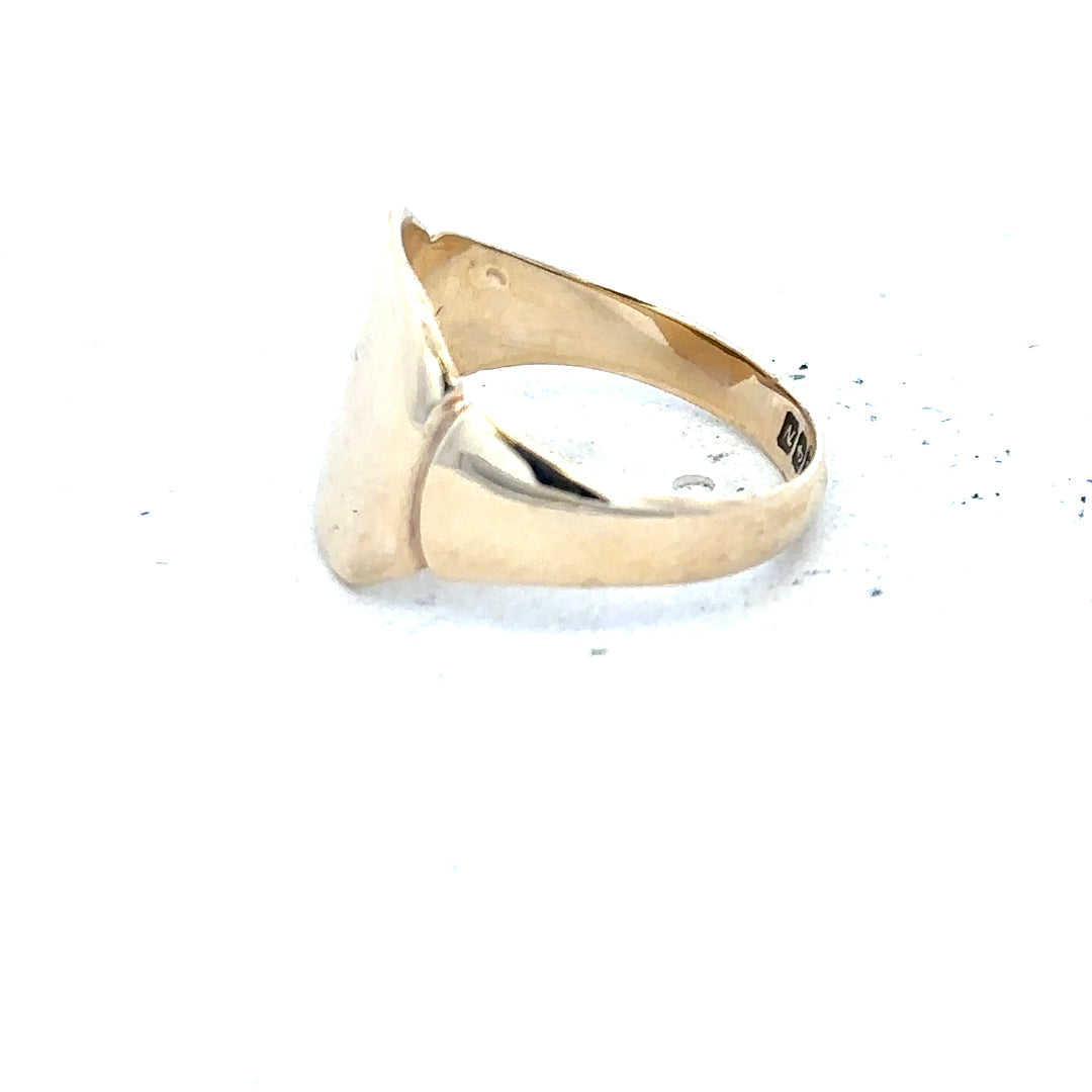 Yellow gold signet ring in size J, unbranded 9ct gold jewelry with a smooth, polished finish.