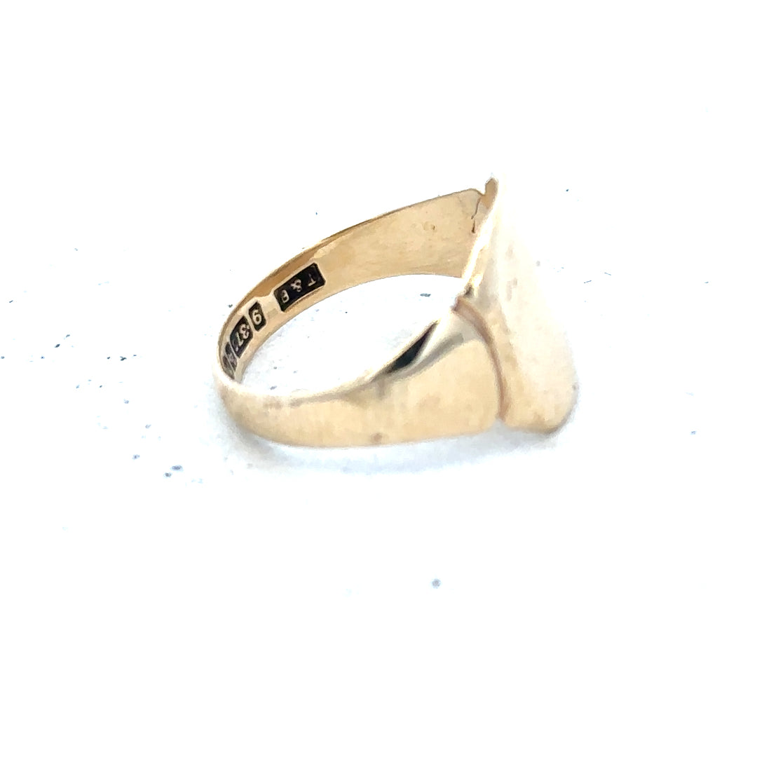 9ct yellow gold signet ring in size J with a smooth, polished surface, unbranded, classic jewelry design.