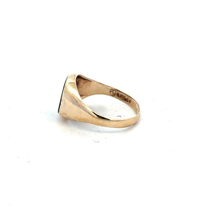 9ct yellow gold signet ring in size X with a smooth polished surface, unbranded, showcasing classic jewelry craftsmanship.