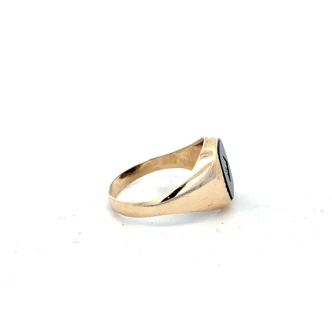 9ct yellow gold signet ring in size X featuring a smooth polished surface and classic design.