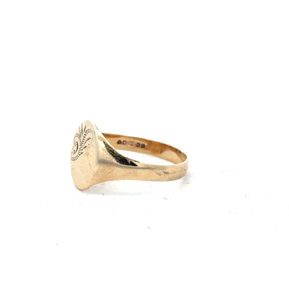 9ct yellow gold signet ring in size Y with a smooth polished surface, unbranded jewelry, close-up view.