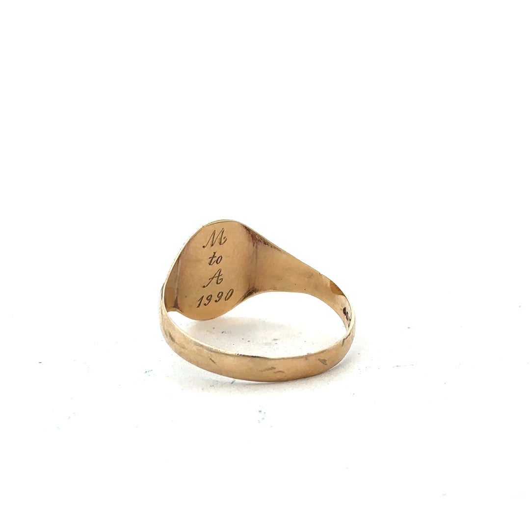 9ct yellow gold signet ring in size Y, featuring a smooth polished surface and classic design.