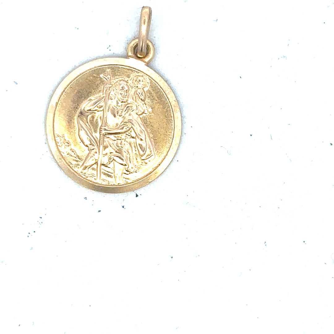 9ct yellow gold St Christopher pendant, unbranded, weighs 3.1g, featuring a detailed religious pendant design.