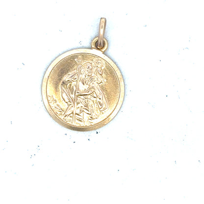 9ct yellow gold St. Christopher pendant, unbranded, weighing 3.1g, featuring detailed religious iconography in a classic design.