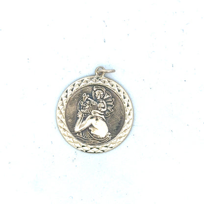 9ct yellow gold St Christopher pendant weighing 4.9g, unbranded jewelry with detailed religious medal design.