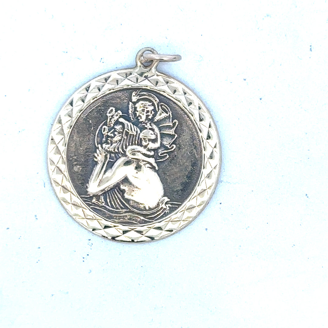 9ct yellow gold St Christopher pendant, unbranded, weighing 4.9g, featuring detailed religious medal design on a chain.