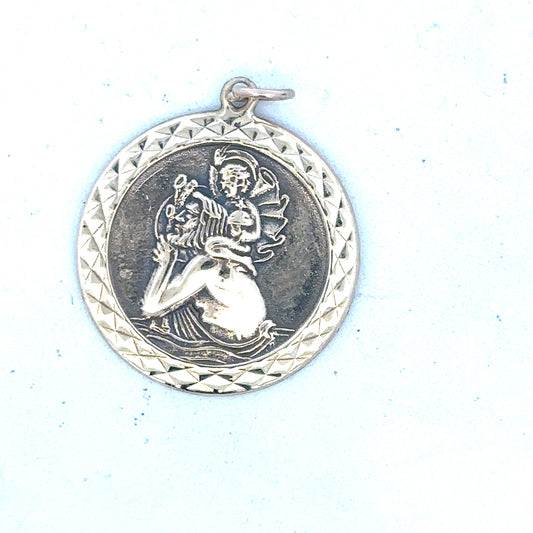 9ct yellow gold St Christopher pendant, unbranded, weighing 4.9g, featuring detailed religious medal design on a chain.