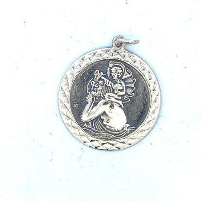 9ct yellow gold St Christopher pendant, unbranded, weighing 4.9g, displayed with detailed engraving and polished finish.