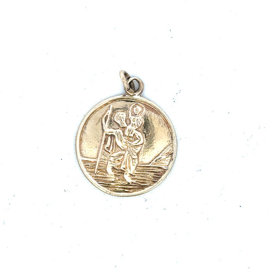 9ct yellow gold St. Christopher pendant, unbranded, weighing 5.7g, featuring detailed religious symbol on a chain.