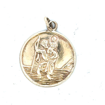 9ct yellow gold St. Christopher pendant weighing 5.7g, unbranded jewelry with detailed religious design.