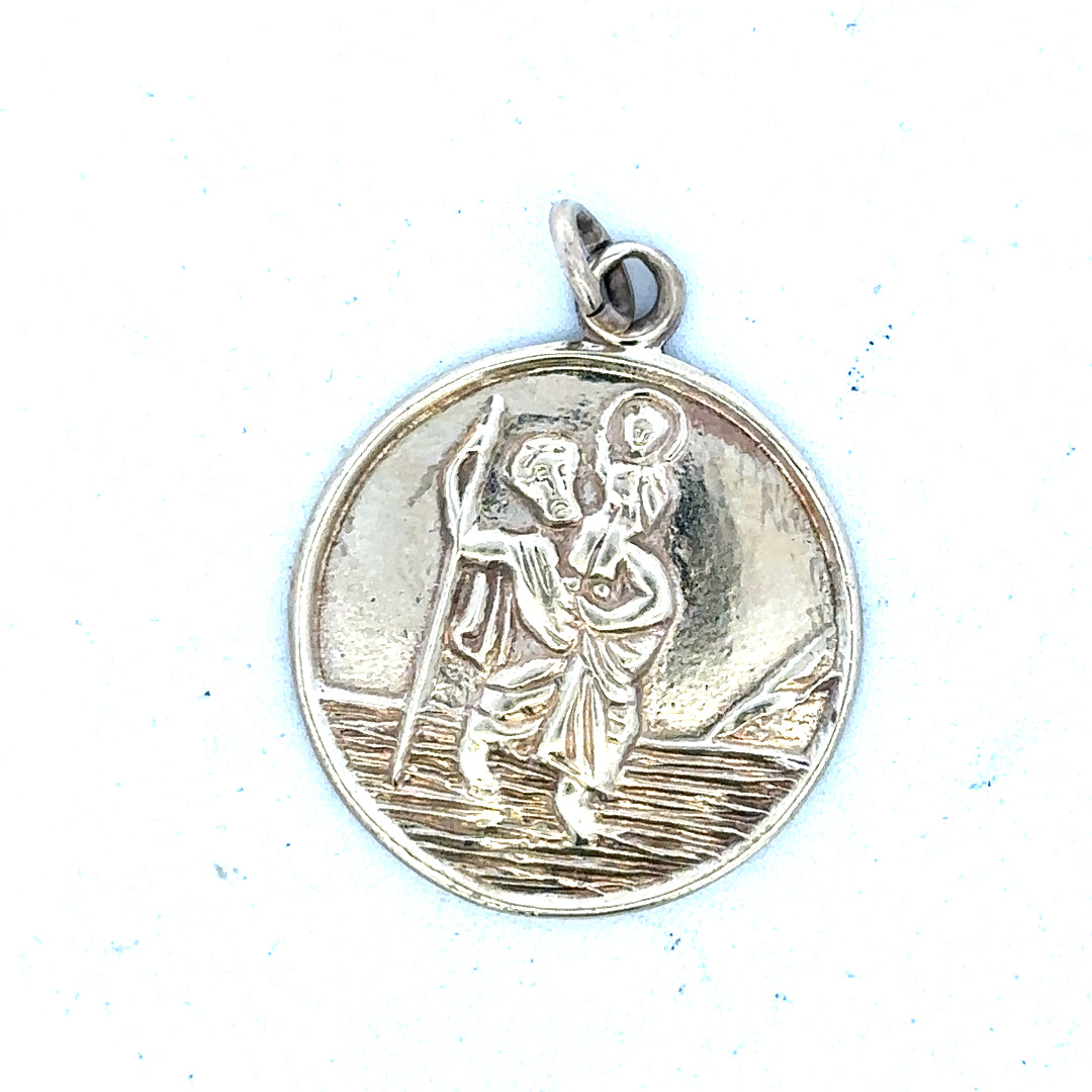 9ct yellow gold St. Christopher pendant weighing 5.7g, featuring detailed religious medal design, unbranded jewelry accessory.