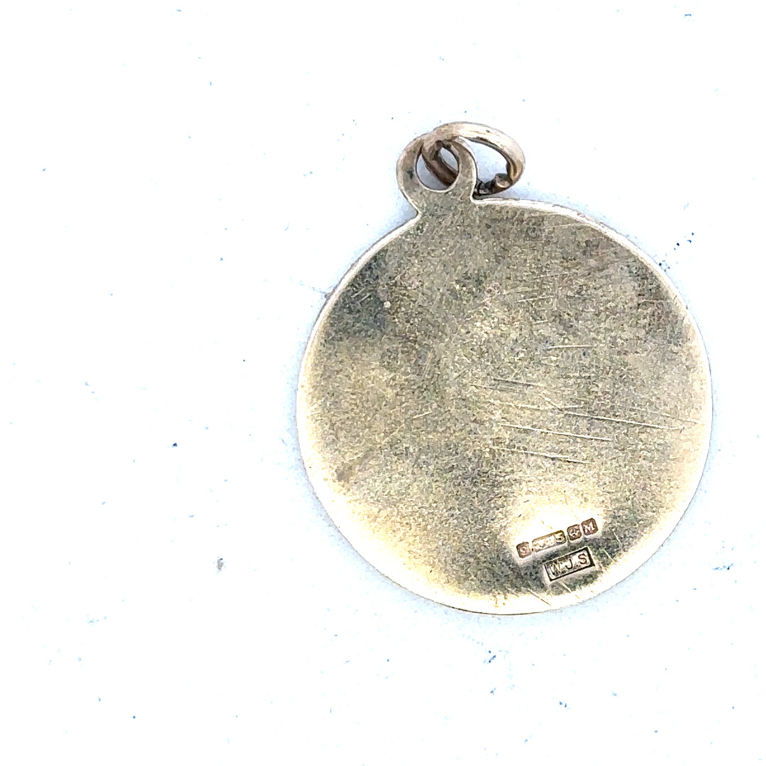 9ct yellow gold St. Christopher pendant, unbranded, weighing 5.7g, featuring detailed religious design, shown against a neutral background.
