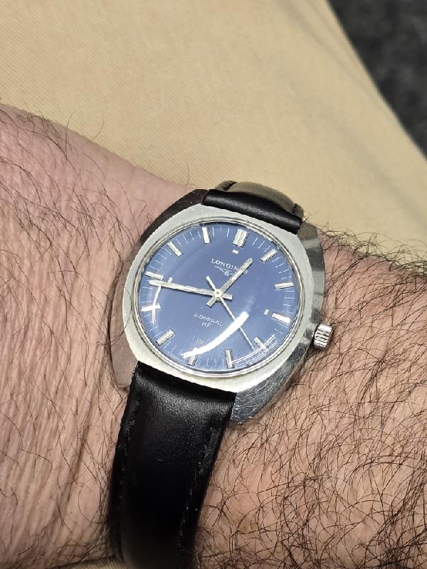 Longines 1972 Munich Olympics watch with silver dial and stainless steel bracelet, showcasing vintage sports watch design.