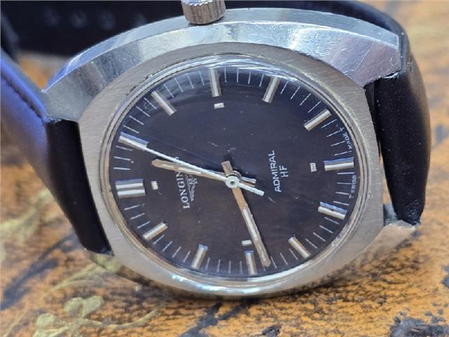 Longines 1972 Munich Olympics watch with silver dial and stainless steel band, featuring Olympic logo and chronograph details.