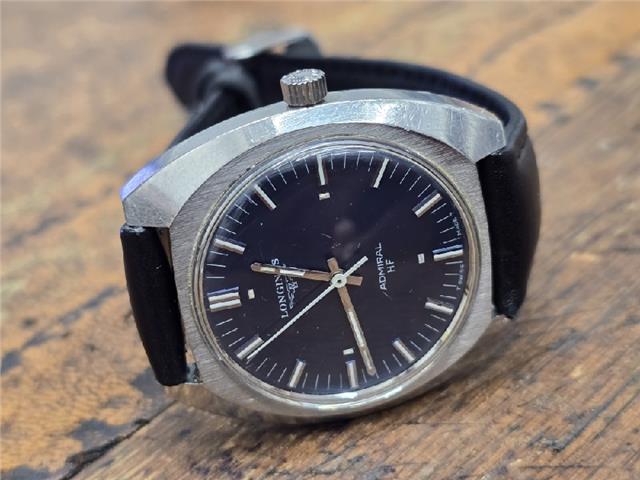Longines 1972 Munich Olympics watch with silver dial and stainless steel bracelet, vintage sports watch design.