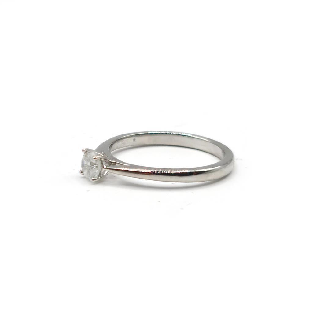 Platinum 0.26 carat diamond solitaire ring with a single sparkling diamond set in a sleek platinum band.