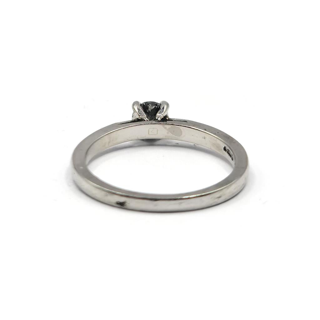 Platinum 0.30 carat solitaire brilliant cut diamond ring with a smooth band and central sparkling diamond.