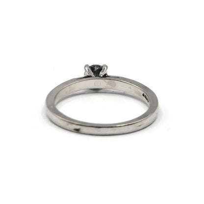 Platinum 0.30 carat solitaire brilliant cut diamond ring with a sleek band and a sparkling central diamond.